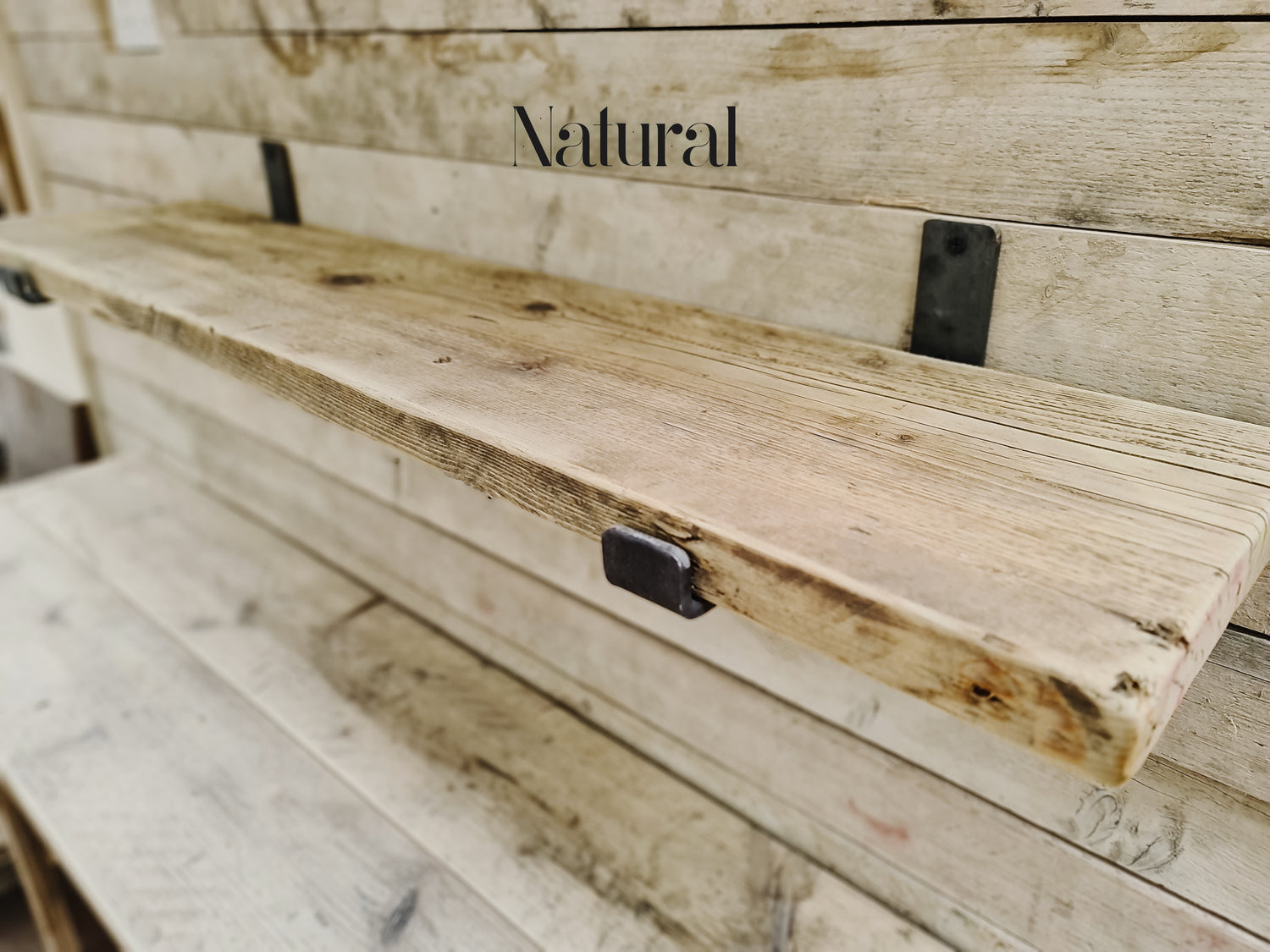 Reclaimed wood shelves with aged steel brackets