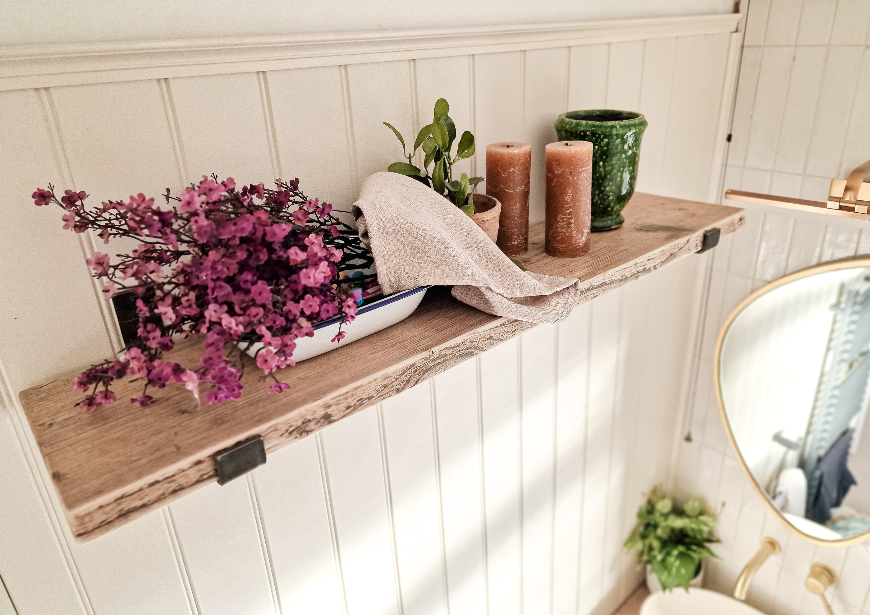 Reclaimed wood shelves with aged steel brackets